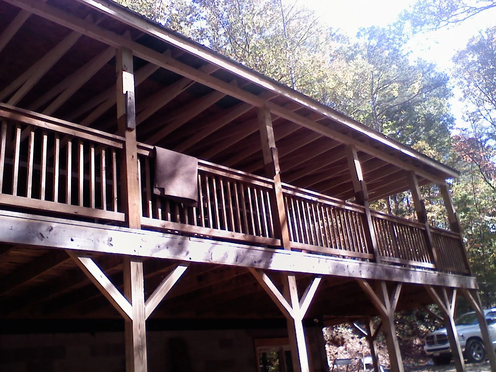 Timber framing under a new elevated porch and deck — Roof Leak Repair in South Lyme by Roofing Brothers